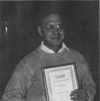 Andrew J. (Jack) Roberts collected a certificate and a $500 check as the Grand Prize winner in the L.A.S.C.'s Songwriting Competition '89. His tune, 'The Limestone Church,' was recorded by the New Horizon band at Artec Studio in Salem, Ind. Photo By Tom Metcalfe