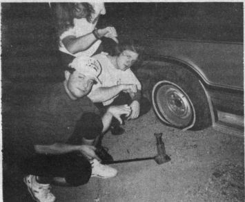 A flat tire on a deserted Mississippi road gets the thumbs down from (bottom to top) Jeff Blocker, Jeffrey 'Pork Chop' Crain and Joe Straub
