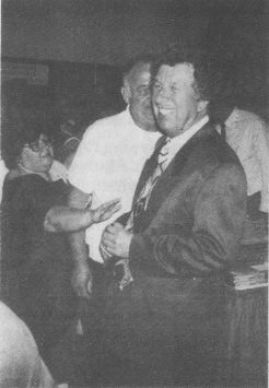 A fan reaches out to tourch veneralbe Southern Gospel artist Bill Gaither at the National Quartet Convention at the Ky. Fair and Expo Center on Sept. 22. Photo by Jean Metcalf