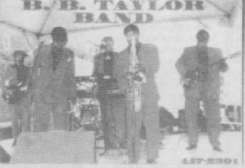 Jerome Hawlett playing sax with the B. B. Taylor Band at the `1994 Garvin Gate Blues Festival. Photo by Jim Gilbert