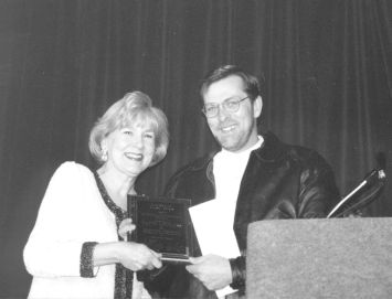 Jean Mefcalfe presented the Lifetime Achievement Award in the Country category to Roger Ramey, brother of Patty Loveless, accepting on her behalf. Photo by Tom Metcalfe