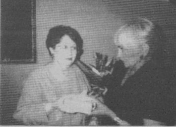 Kentucky Opera Guild President Diana Winkler, right, presents B. J. Mason with the Guild's