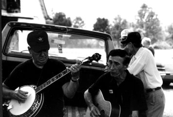 Bardstown banjo player George Brown and Louisville guitarist Leroy Matherly took advantage of a supper break to join with other parking lot pickers in a rousing rendition of