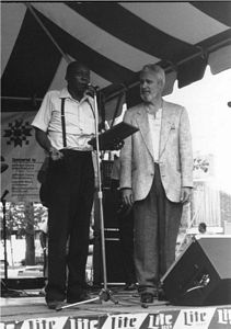 Henry Woodruff, left, received the Sylvester Weaver Award from Rocky Adock at the 1989 Garvin Gate Blues Festival